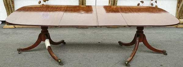 A REGENCY MAHOGANY D-END EXTENDING DINING TABLE