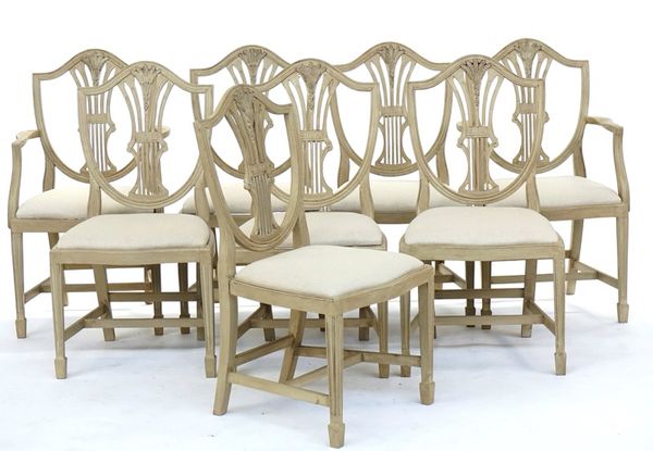 A set of eight distressed grey painted Hepplewhite style shield back dining chairs