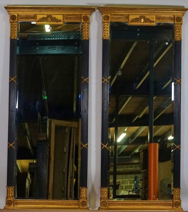 A pair of Regency style parcel gilt ebonised tall rectangular robing mirrors