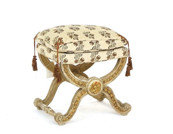 An 18th century French style parcel gilt cream painted x-frame stool