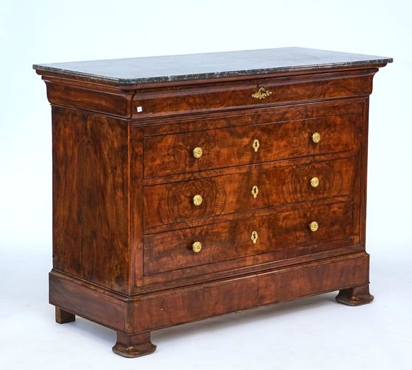 A French figured walnut four drawer commode