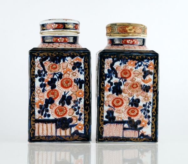 A PAIR OF JAPANESE IMARI CANISTERS AND TWO COVERS