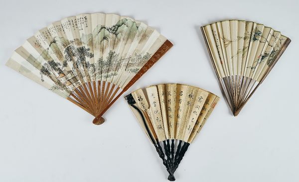 A Chinese paper fan and two others