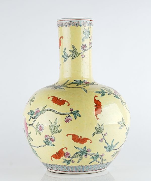 A large Chinese yellow-ground famille-rose bottle vase