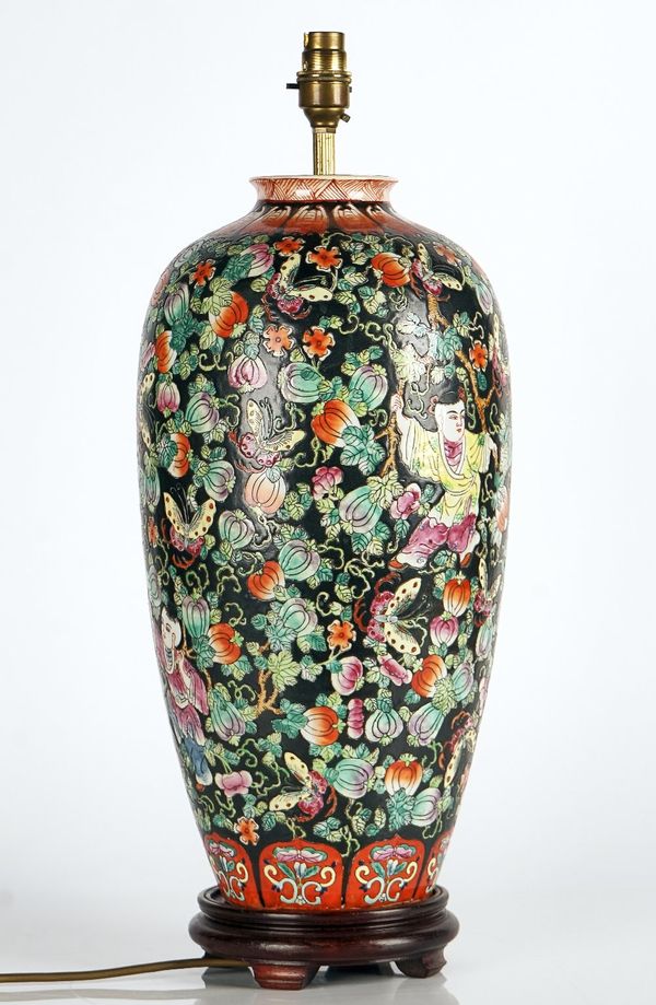 A Chinese porcelain black-ground famille-rose vase adapted as lamp