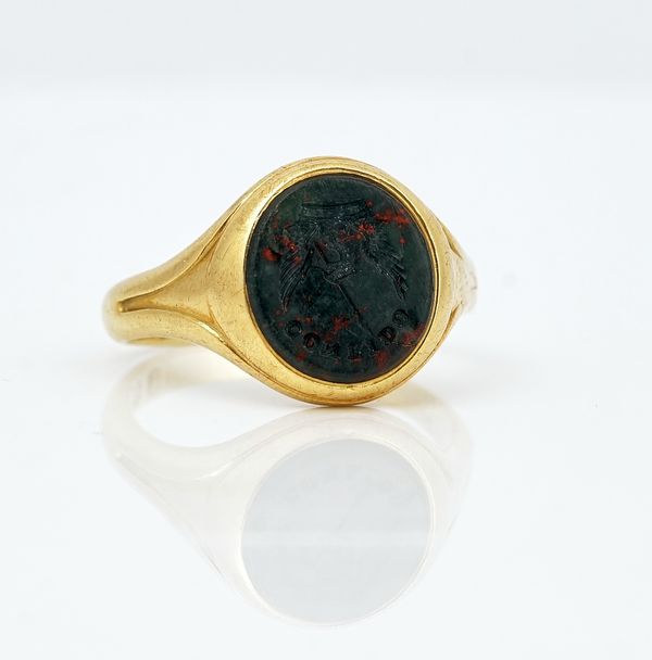 An 18ct gold and bloodstone oval signet ring