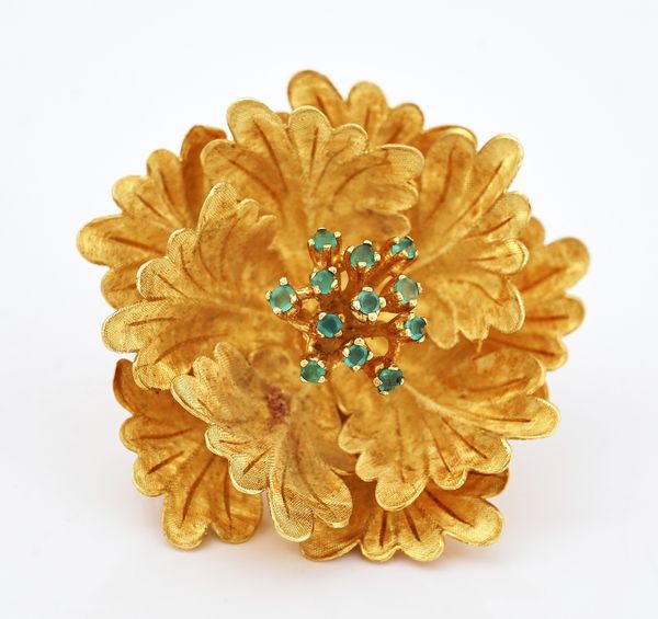 A gold and green gem set brooch