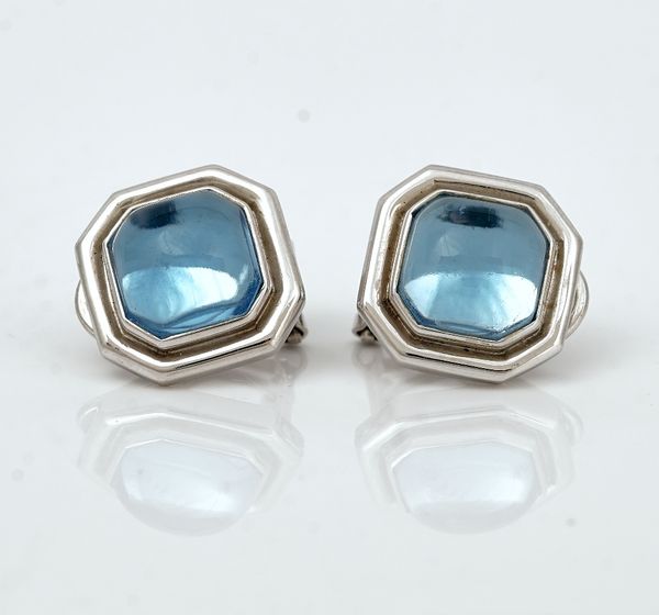 A pair of cabochon blue topaz and white gold earclips