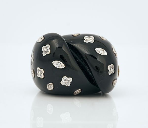 A black onyx and diamond set dress ring