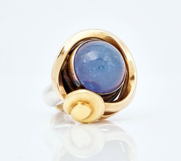 A gold, silver and tanzanite set dress ring by Tom McEwan