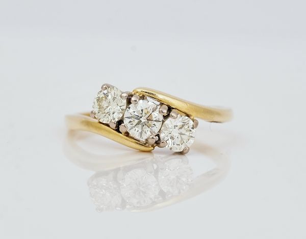 An 18ct gold and diamond set three stone ring