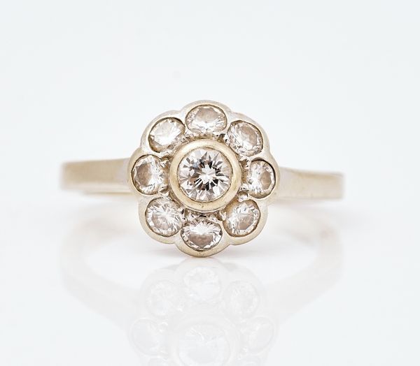 A diamond nine stone cluster ring