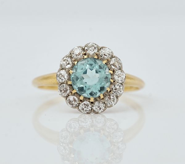 A gold, diamond and aquamarine cluster ring