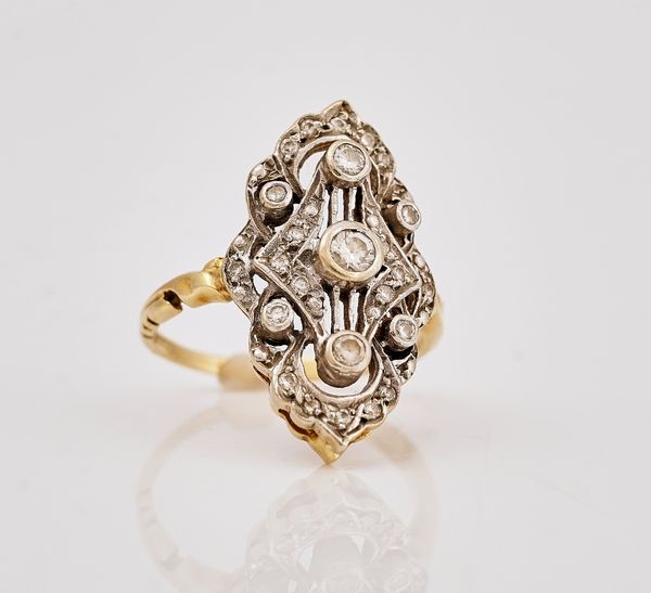 A gold and diamond panel shaped ring