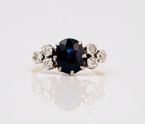 A gold, sapphire and diamond ring