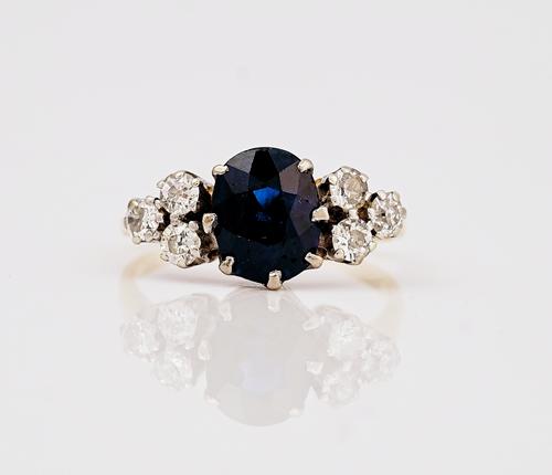 A gold, sapphire and diamond ring