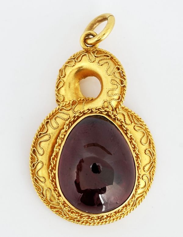 A Victorian gold and carbuncle garnet drop shaped pendant