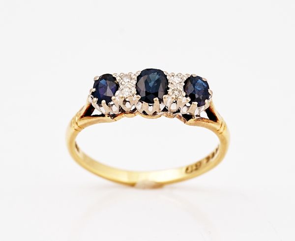 An 18ct gold, sapphire and diamond ring