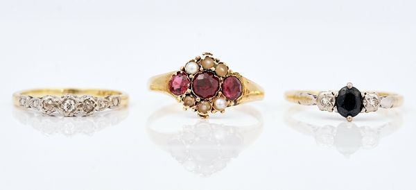 A gold, sapphire and diamond three stone ring and two further rings (3)