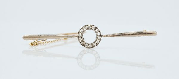 A gold and diamond set bar brooch