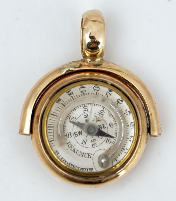 A gold mounted compass/thermometer fob seal