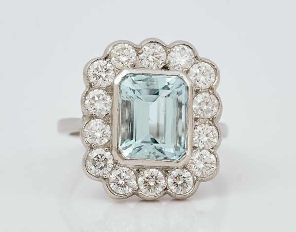 A platinum, aquamarine and diamond cluster ring