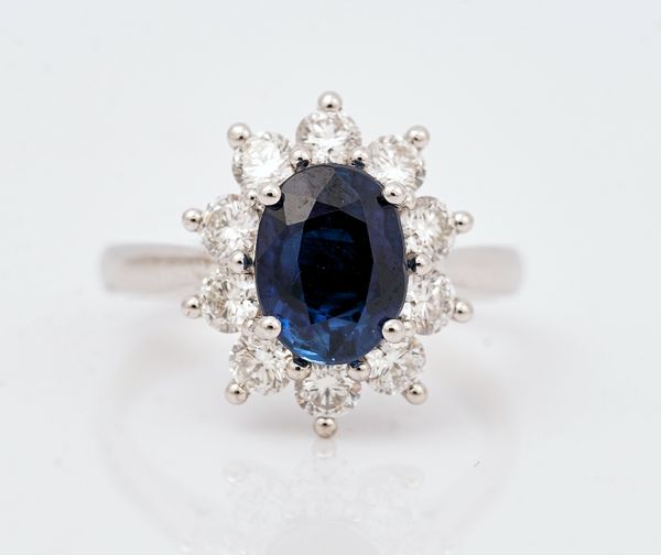 A platinum, sapphire and diamond cluster ring