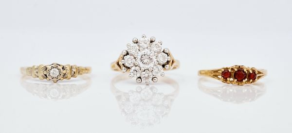 Three gold and gem set rings (3)