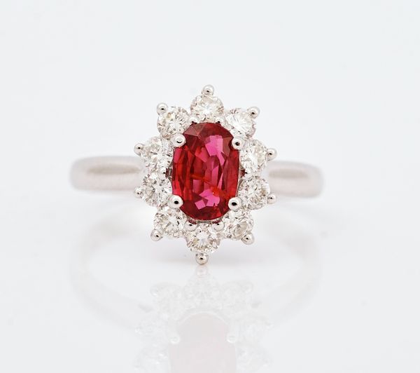An 18ct white gold, ruby and diamond set cluster ring