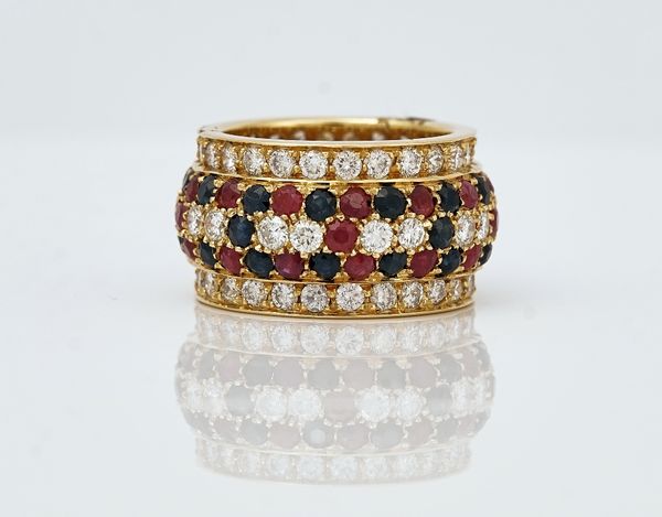 A gold, diamond, sapphire and ruby band ring