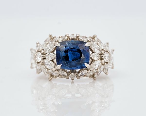 A platinum, sapphire and diamond set dress ring