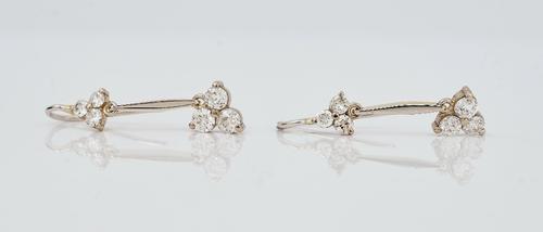 A pair of platinum and diamond pendant earrings