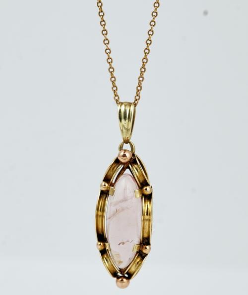 A gold and rose quartz drop shaped pendant, with a neckchain