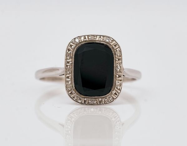A French platinum, black onyx and diamond ring