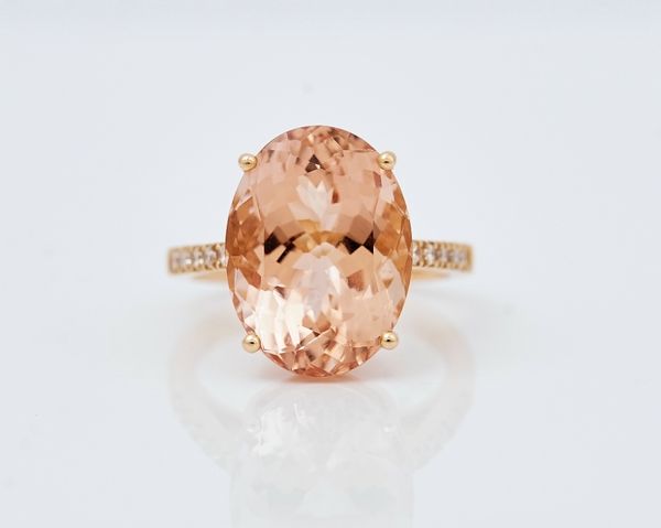 An 18ct rose gold, morganite and diamond set cluster ring