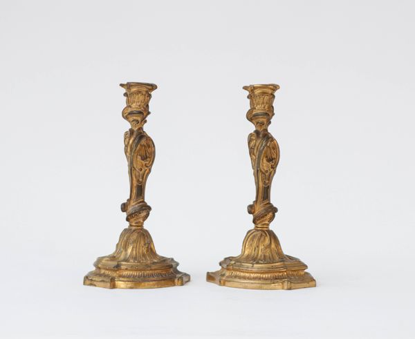 A pair of French gilt-bronze candlesticks