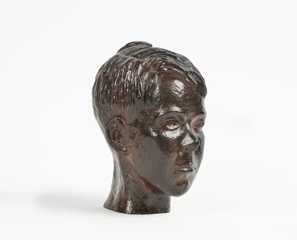 A bronze bust of a young boy