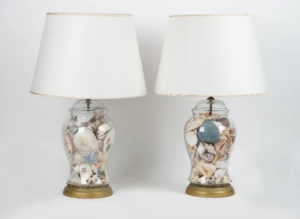 A pair of glass and shell filled baluster table lamps