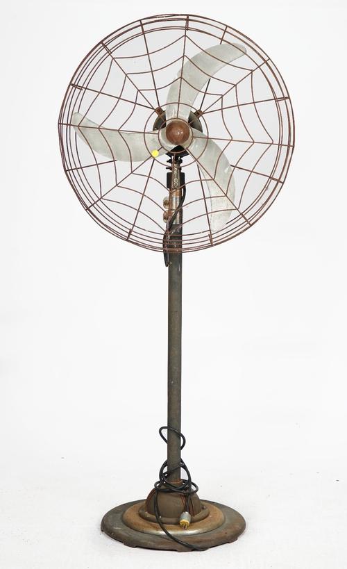 A large floor standing electrical fan