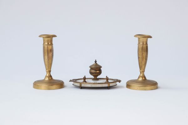 A French gilt-bronze and white marble desk stand and a pair of gilt-bronze candlesticks