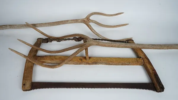 A bow saw and other tools