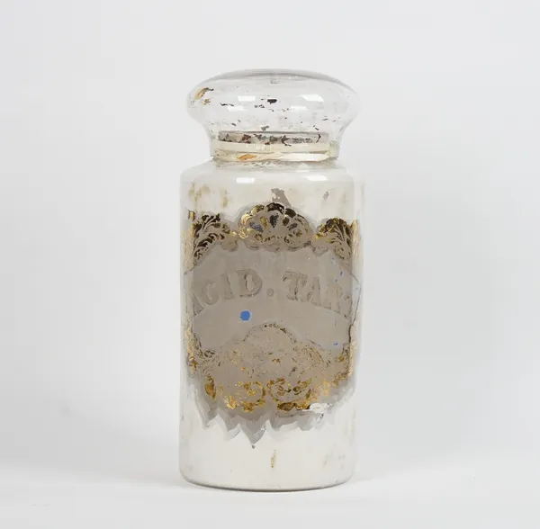 An apothecary glass jar and cover