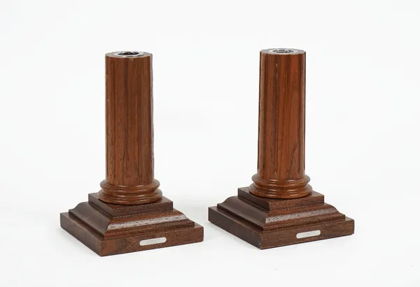 LINLEY LONDON; A pair of mahogany candlesticks