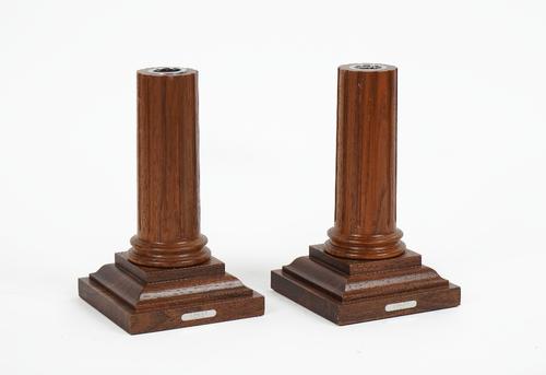 LINLEY LONDON; A pair of mahogany candlesticks