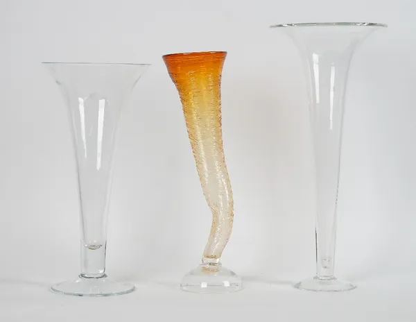 An amber glass cornucopia flower vase