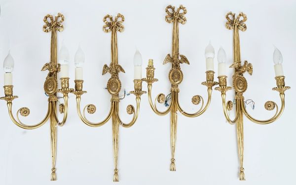 A set of four Louis XVI style gilt-metal wall lights