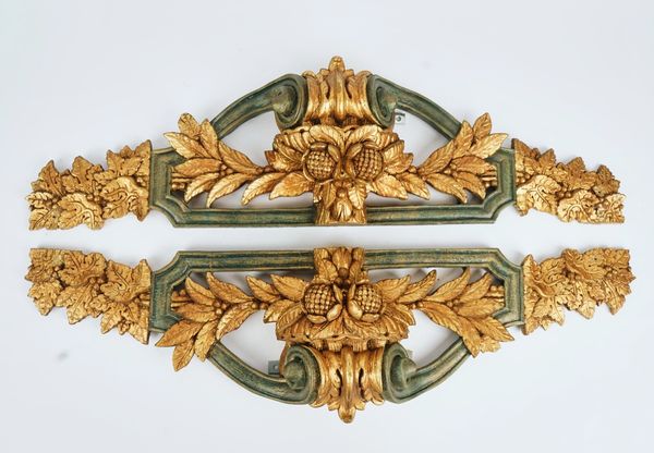 A pair of decorative resin window cornices