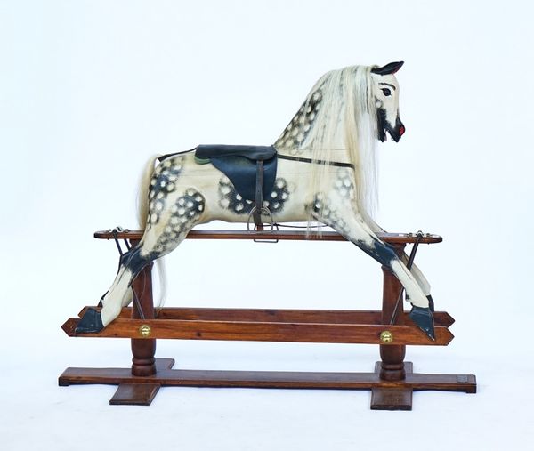 A painted wooden rocking horse