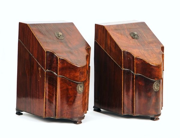 A pair of George III chevron banded mahogany serpentine fronted knife boxes