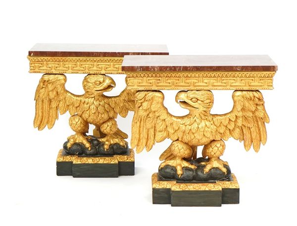 A pair of giltwood and ebonised 18th century style console tables